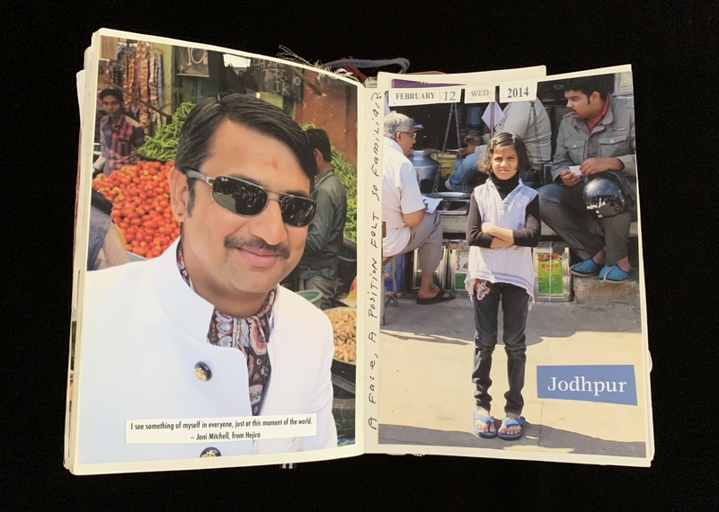 Open book with photos of a man at a market and a girl standing in a marketplace labeled "Jodhpur."