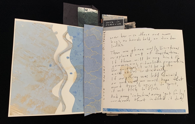 Handmade scrapbook with abstract designs and handwritten text.