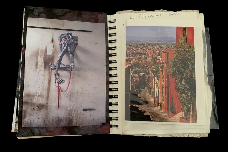 A page from a scrapbook featuring a photograph of a skeletal figure and a scenic view of a cityscape.