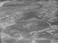 An aerial photo of a sandy forested area. There are a few roads through the area.