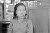 "Unidentified", picture of a Vietnamese woman. She blinked as the photo was taken.