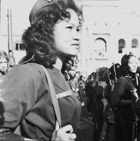 Original caption: "Mne. Nhu + Paramilit. Graduation - 27 Feb 63" Young Vietnamese paramilitary woman is standing in military formation.