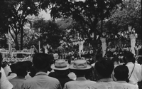 "Students wrecking min. of info." The crowd parades down the street with two large banners and the South Vietnamese flag.