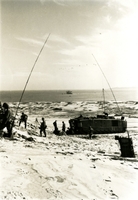 Soldiers gathering on the shore. Navy/Marine Amphibious Operations photos.