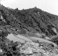"Korea-Negs 181-3(1)-182-3(1) 12.Terracing" Four terraced rice fields are built into a steep mountain. The fields are flooded. From scrapbook page 23.