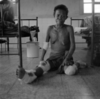 "QN + Train ", picture of an old man sitting on the floor, beds in the background (ALFs?)