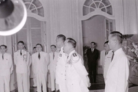 Nguyá»…n KhÃ¡nh at a formal meeting.