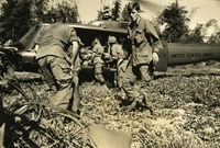 "Operation 'Baker,' Near Duc Pho, Vietnam - Troops of 25th Infantry Division, load captured Viet Cong rice aboard a UH-1D helicopter transportation to Vietnamese villagers. The rice was captured during an action conducted by U.S. Army elements of Task Force 'Oregon.'" American soldiers unloading sacks from an Army helicopter in a field.
