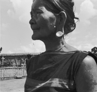 "Montagnards - Showplace Strat. Ham - 8-21-62 - In MTs - Faces - Blockhouses" A profile shot of woman villager.