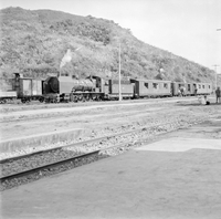 "QN + Train ", photo of a building and a street