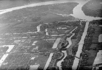 An aerial photo of a city or military camp with old fortress walls and a moat.