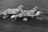 "7th Fleet" A row of three Naval planes on an aircraft carrier.