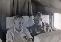 William Westmoreland and another American man sit next to each other on a plane.