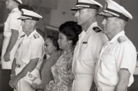 Nguyá»…n Thá»‹ Mai Anh and another Vietnamese woman stand with American officers. They are onboard a US Navy 7th Fleet ship.