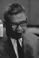 "Huong." Trần Văn Hương looking down at notes.