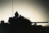 "11th Armored Calvary Regiment, Long Giao, Vietnam - Sunset." The silhouette of soldiers on a tank.