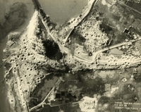 "Before and After near Thanh Hoa, North Vietnam - Navy jet pilots of Carrier Air Wing 15 pounded a railroad ferry complex northeast of Thanh Hoa Sep. 21-23, 1966. Targets included a thermal power plant, defending flak sites, railways, boxcars, and roads. After the raid shown in these before and after photos, Navy Intruder and Skyhawk pilots described the area as 'devastated.'" Aerial photo of a bombed landscape with roads, a village, a railway, a river, and farms.