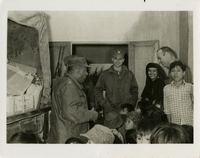 Original title: "Seabees! Sisters! Orphans! Toys!"  "Commander B. L. Saravia, Mobile Construction battalion FORTY commanding officer, jokes with Sister Mary Consolation and children of the Sam Hai Catholic church near Chu Lai, South Vietnam, before recently presenting their Chapel with 12 boxes of toys. The sister then gave them to orphans and needy families. Standing with the sister are from left: commander Saravia: Lieutenant (junior grade) D. P. Bodine, MCB-40 Catholic Lay Leader; Sister Mary Consolation; and Chaplain (Father) James Harris from MCB-8, who works closely with Sam Hai Parish." Delivery of toys to Vietnamese orphans by Seabees. Seabees news release 3-67 (62).