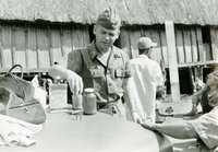 An American soldier named Hibbs is looking at some pill bottles and talking.