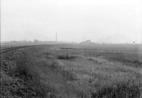 Original caption: Dried-up marsh, east end of Salt Basin. An unidentified man stands amid the marsh. Oct. 1918