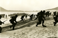 Troops running from ships onto shore. Navy/Marine Amphibious Operations photos.
