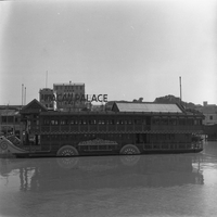 "Macau" A large boat with a illuminated sign reading "Macau Palace" on the top.