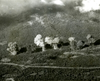 Aerial photo of a line of bombs exploding.