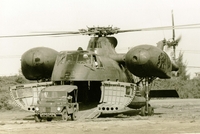 "The CH37 'Deuce' is a twin-engine, heavy transport helicopter utilized for cargo and personnel." A US Marine Corps helicopter sits in a field and unloads a military Jeep.