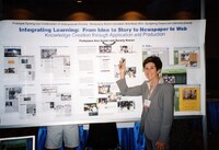 Beverly Keever presenting a conference poster on teaching journalism at the University of Hawai’i Manoa, 2003. The Conference poster is titled “Integrating Learning: From Idea to Story to Newspaper to Web” by Professors Ann Auman and Beverly Keever.