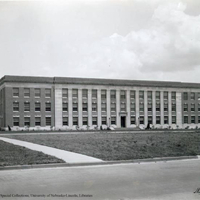 South facade of Andrews Hall. The grassy area in the foreground was used as the military drill field until the early 1930s.