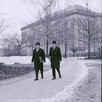 Original caption: "Chancellor Hardin and Joseph Soshnik walking in front of library."