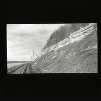 Original caption: XXIV-6 NAB. Apr. 14, 1912. Two lower l.s. in scarp west of Oreapolis. Basal ledge is the lowest in Nebraska series. Cass County. (121111-00227)