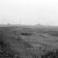 Original caption: Dried-up marsh, east end of Salt Basin. An unidentified man stands amid the marsh. Oct. 1918