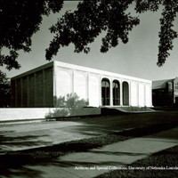 Fred Wells, President, Nebraska Art Association, Clarence Swanson, Board of Regents, and Mrs A. Bromley Sheldon (Olga) inspect the travertine marble during construction of the gallery.